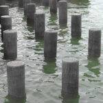 Brown Recycled Plastic Piles in water
