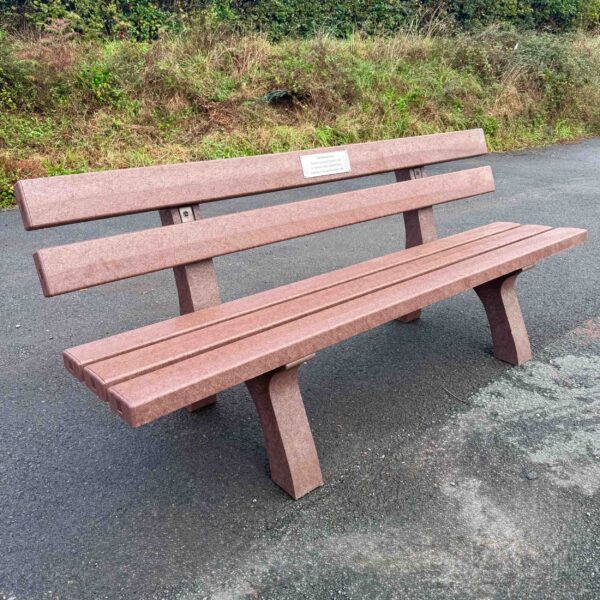 Piccadilly park bench with memorial plaque